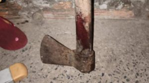 Homem preso por matar irmão a machadada